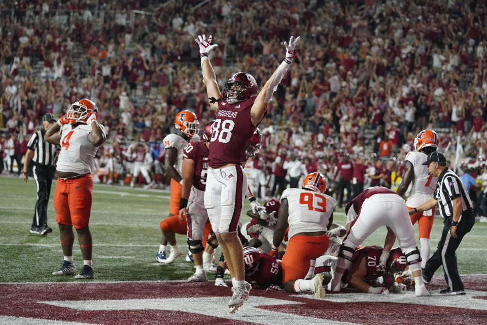 Indiana's AJ Barner (88) celebrates after Shaun Shivers scored the go-ahead touchdown late in the fourth quarter of the team's NCAA college football game against Illinois, Friday, Sept. 2, 2022, in Bloomington, Ind. Indiana won 23-20. (AP Photo/Darron Cummings)