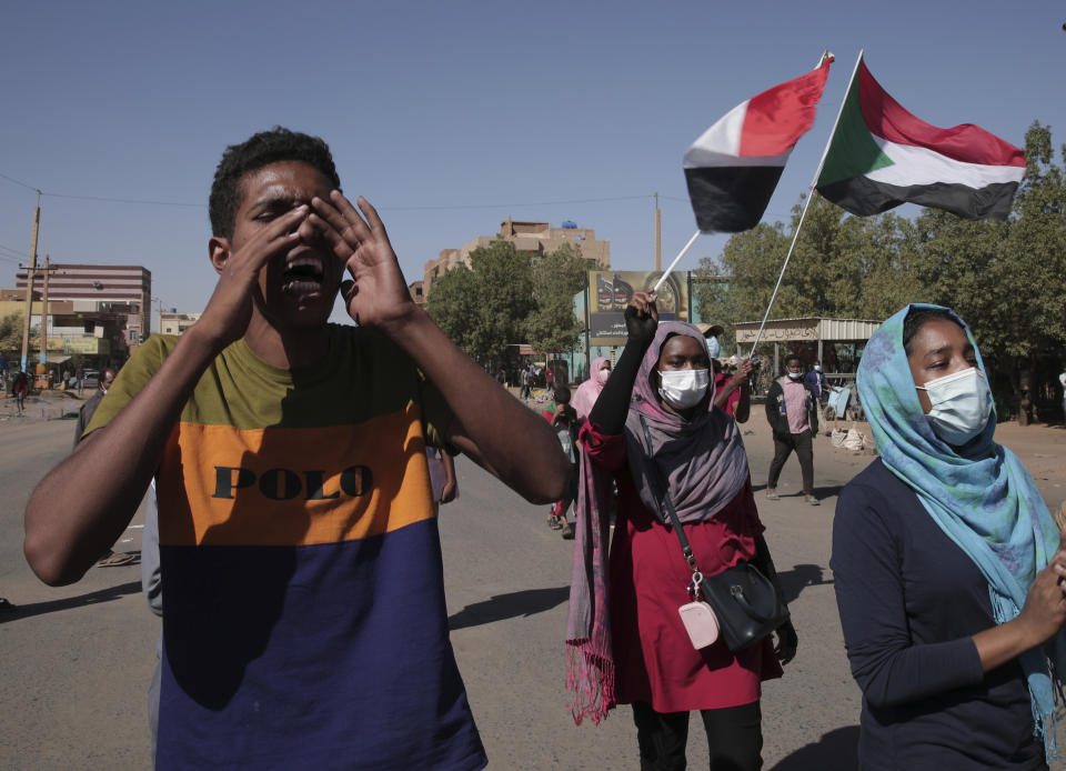 Protesters take to the streets to renew their demand for a civilian government in the Sudanese capital Khartoum, Thursday, Nov. 25, 2021. The rallies came just days after the military signed a power-sharing deal with the prime minister, after releasing him from house arrest and reinstating him as head of government. The deal came almost a month after the generals orchestrated a coup. Sudan’s key pro-democracy groups and political parties have dismissed the deal as falling short of their demands for a fully civilian rule. (AP Photo/Marwan Ali)