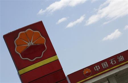 PetroChina's logo are seen at its gas station in Beijing, August 29, 2013. REUTERS/Kim Kyung-Hoon