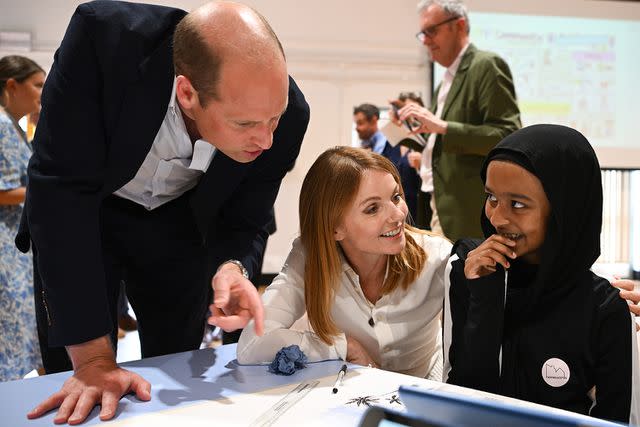 <p>Finnbarr Webster/Getty Images</p> Prince William and Geri Halliwell-Horner meet children at the Maindee Primary School on June 26