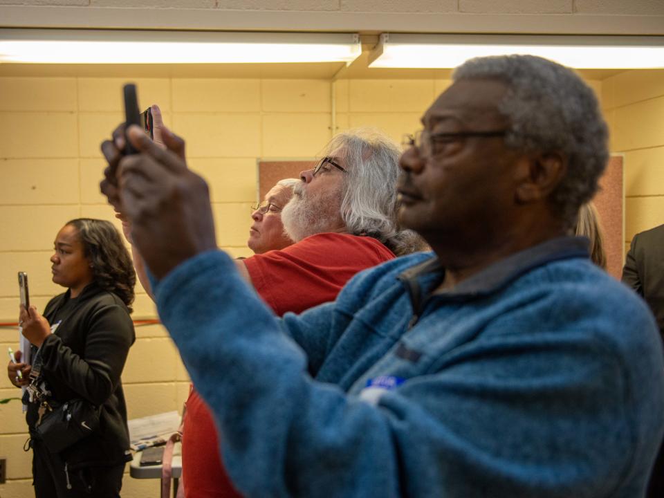 Concerned citizens record as School Board Chairman James Johnson speaks after the Jackson-Madison County School Board meeting on Monday, Oct. 16, 2023.