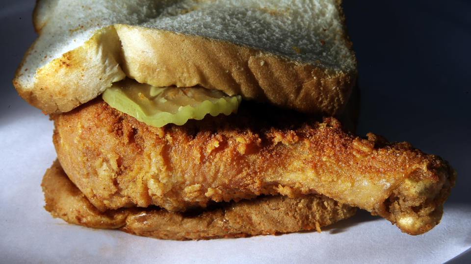 This Friday, March 22, 2013 photo shows Nashville's signature dish, hot fried chicken being served at Bolton's Spicy Chicken and Fish restaurant in Nashville, Tenn. Hot chicken, fried chicken with varied amounts of seasoning that make the heat level run from mild to extra hot, can shock your mouth and have you begging for more. (AP Photo/Mark Humphrey)