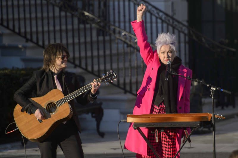 Cyndi Lauper raises her fists in the air during a bill signing ceremony for The Respect for Marriage Act, which requires the U.S. federal government to recognize the validity of marriage between same-sex and interracial couples, on the South Lawn of the White House in Washington in 2022. File Photo by Bonnie Cash/UPI