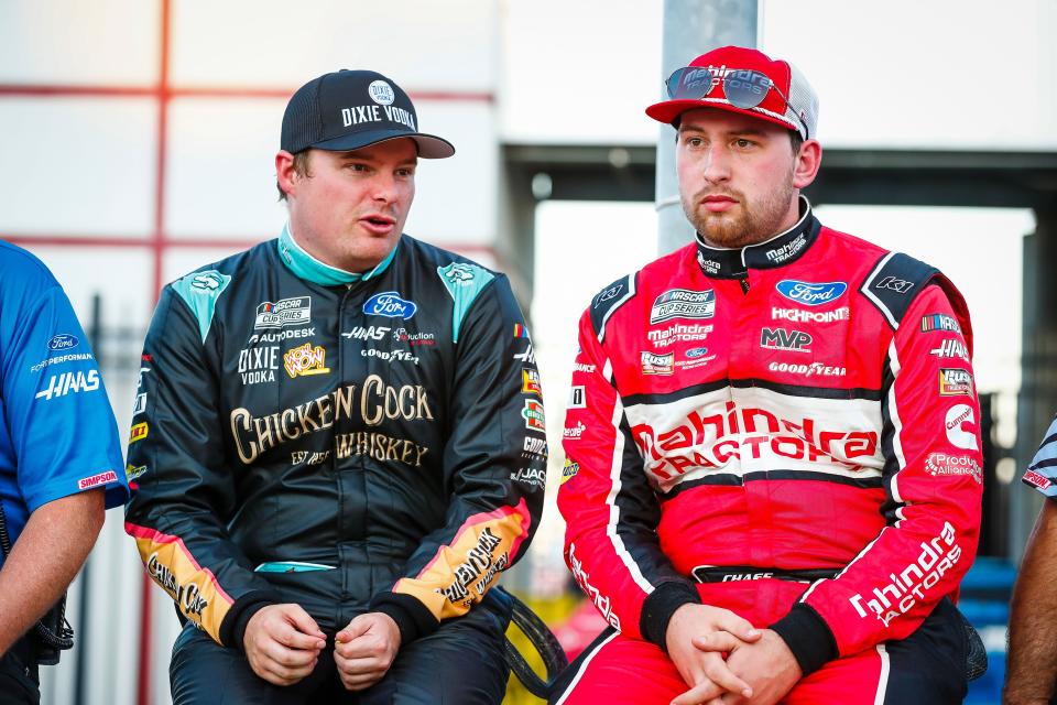 Mitchell's Chase Briscoe (right) talks with SHR Racing teammate Cole Custer prior to the NASCAR Cup Series race at Charlotte on Memorial Day.