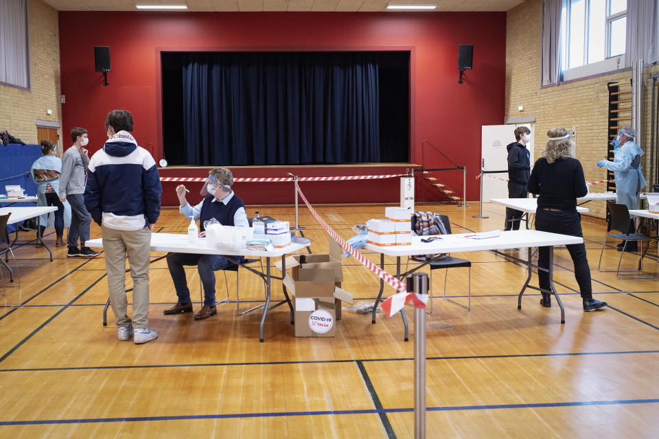 A testing station in a school hall as pupils return to school at Dueholmskolen, Denmark, Monday March 1, 2021. The older students are returning to school classes Monday, with COVID-19 quick testing twice a week in an effort to re-start some normal life. (Bo Amstrup / Ritzau via AP)