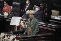 Indonesian President Joko Widodo, wearing the traditional Bangka Belitung outfit, delivers his annual State of the Nation Address ahead of the country's Independence Day, at the parliament building in Jakarta, Indonesia, Tuesday, Aug. 16, 2022. (AP Photo/Tatan Syuflana, Pool)