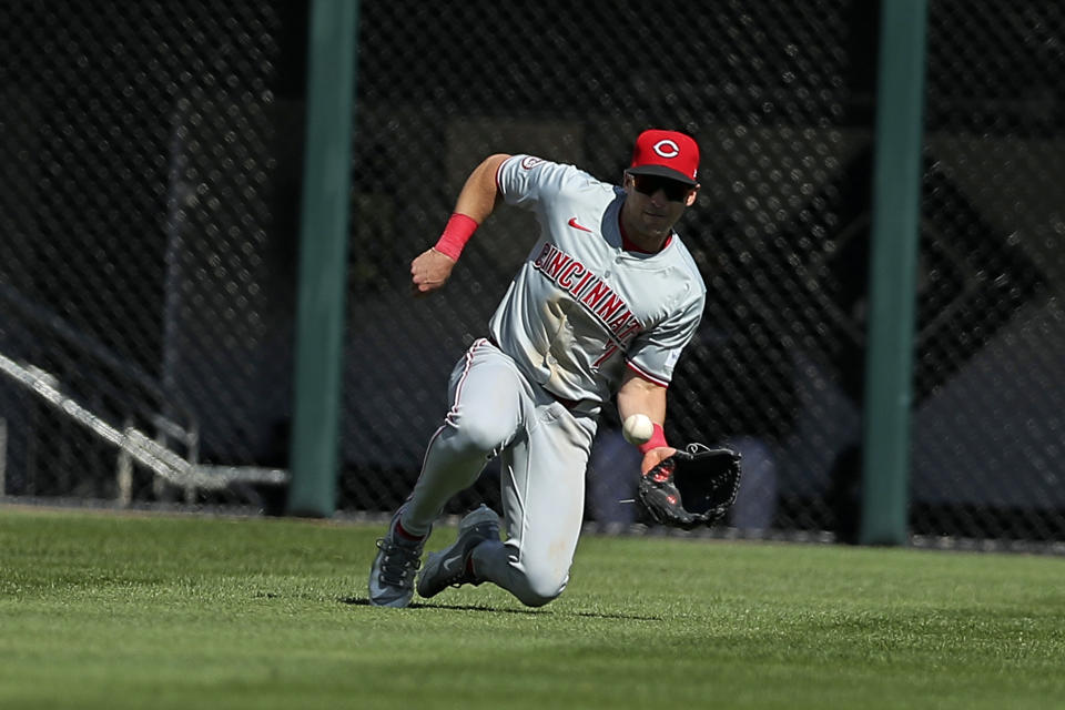 Cincinnati Reds' Spencer Steer makes a catch during the sixth inning of a baseball game against the Chicago White Sox, Saturday, April 13, 2024, in Chicago. (AP Photo/Melissa Tamez)