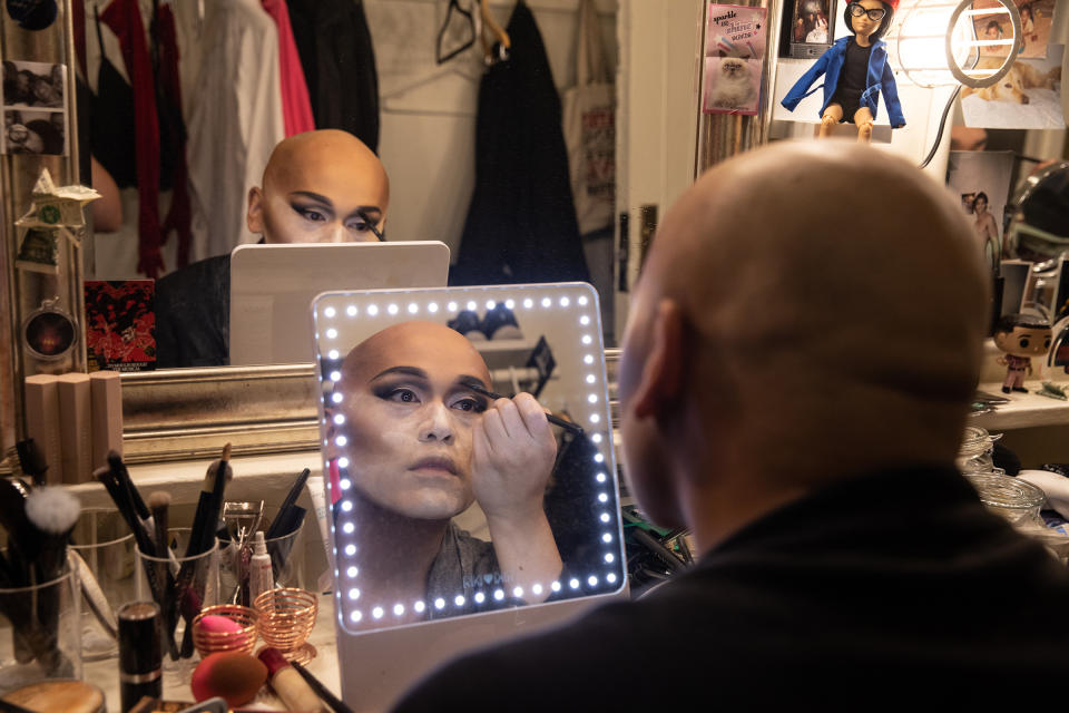 Actor Jeigh Madjus, who plays 'Babydoll,' doing his makeup in the dressing room backstage before rehearsal on on Sept. 21, 2021. Madjus says that sometimes his makeup can take up to two hours to complete.