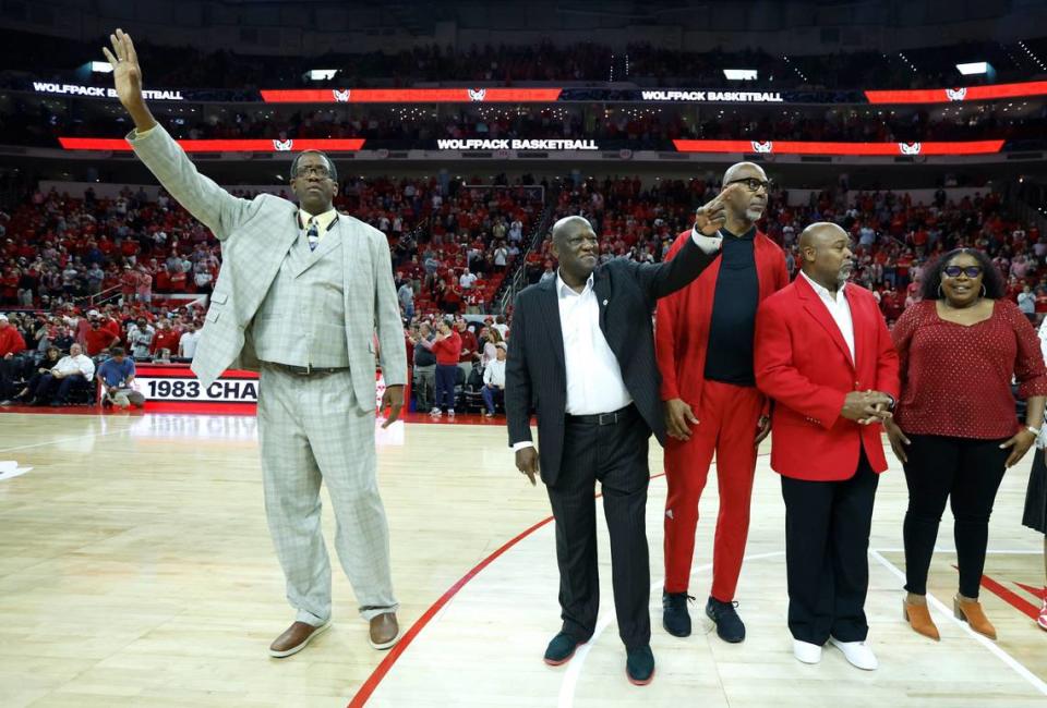 Members of the 1983 N.C. State national championship basketball team, including, from left, Cozell McQueen, Dereck Whittenburg, Thurl Bailey and Sidney Lowe are recognized during halftime of N.C. State’s game against Wake Forest at PNC Arena in February 2023.