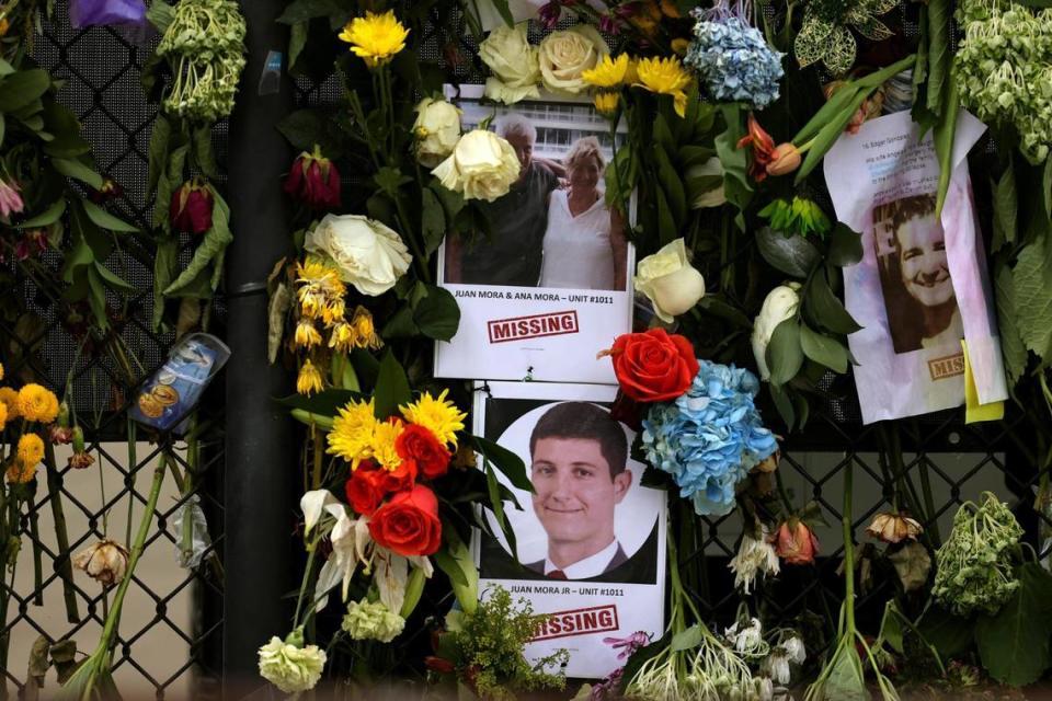 Photographs of victims hang on a memorial wall along a fence near the site at the Champlain Towers South Condo in Surfside, Florida, Wednesday, June 30, 2021. The apartment building partially collapsed on Thursday, June 24.