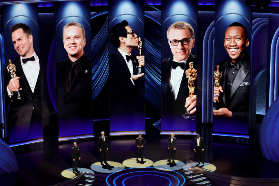 Sam Rockwell, Tim Robbins, Ke Huy Quan, Christoph Waltz and Mahershalal Ali present the Oscar they've all previously received.<span class="copyright">Kevin Winter—Getty Images</span>