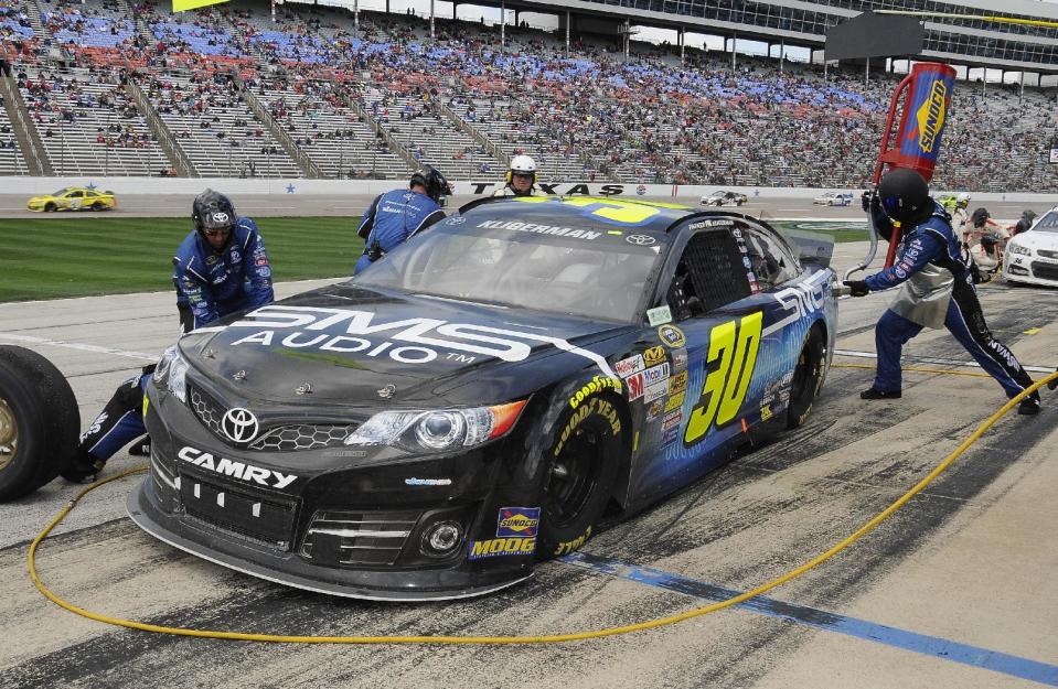 FILE - In this April 7, 2014 file photo, Parker Kligerman (30) pits during the NASCAR Sprint Cup Series auto race at Texas Motor Speedway in Fort Worth, Texas. Swan Racing's future is on the rocks and the two-car team is reviewing its ability to compete in NASCAR. Cole Whitt drives the No. 26 Toyota Camry and Kligerman drives the No. 30 Toyota Camry for Swan in the Sprint Cup series. Swan Racing is owned by Brandon Davis, the CEO of independent oil and gas company Swan Energy. (AP Photo/Larry Papke, File)