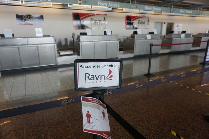 Empty RavnAir ticket counters are seen at Ted Stevens Anchorage International Airport in Alaska