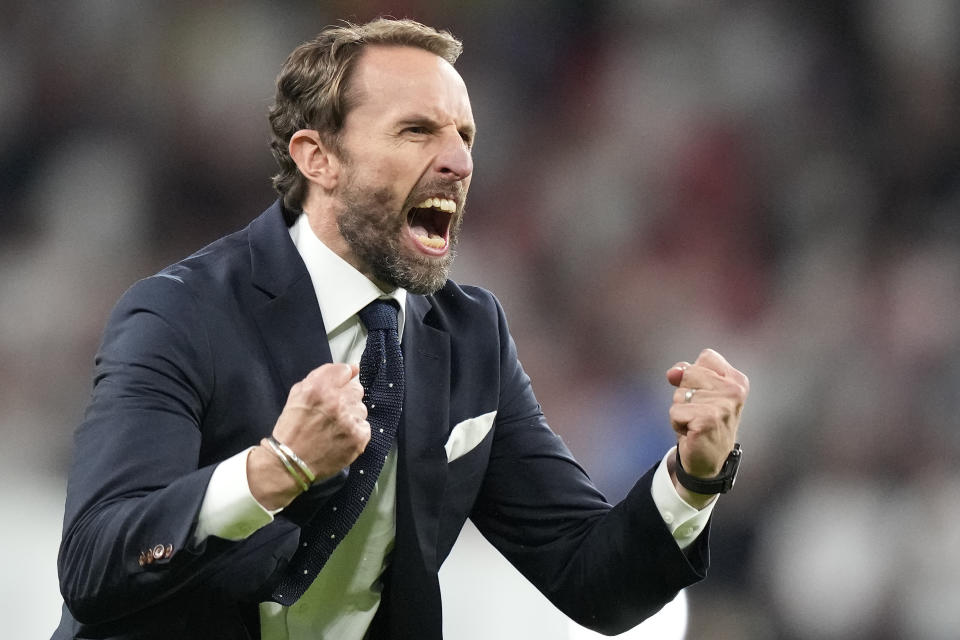 England's manager Gareth Southgate celebrates after winning during the Euro 2020 soccer championship semifinal match between England and Denmark at Wembley stadium in London, Wednesday,July 7, 2021. (AP Photo/Frank Augstein,Pool)