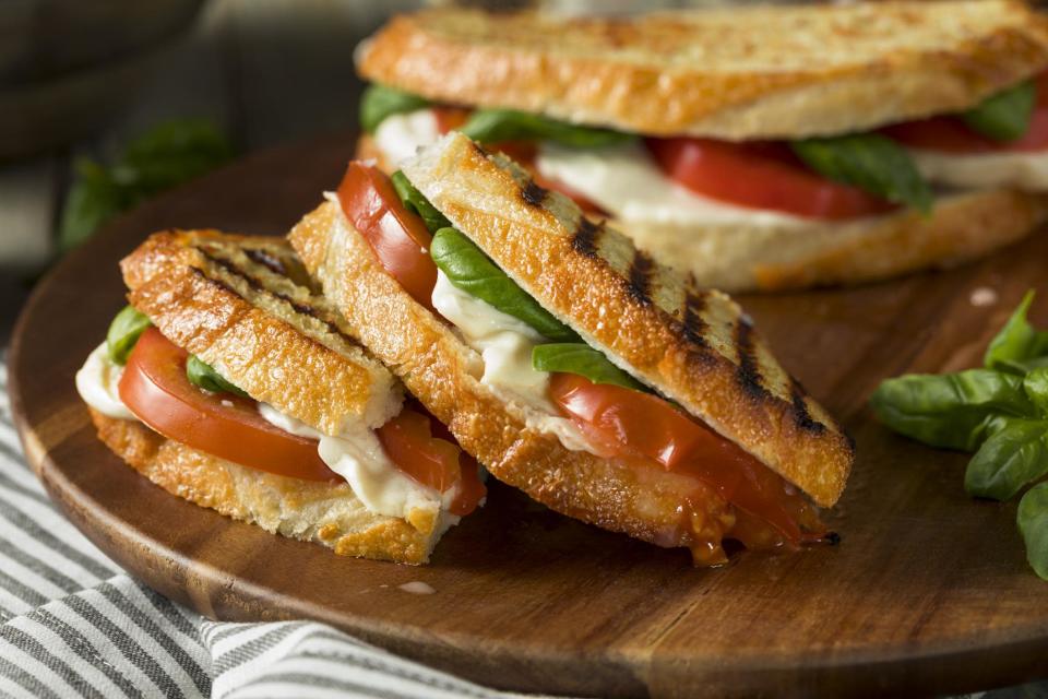 <p>A caprese salad — that classic combination of mozzarella, heirloom tomatoes, fresh basil and a touch of olive oil and balsamic — translates naturally to a grilled cheese. This combination gives a fresh, mature flavor to this <a href="https://www.thedailymeal.com/cook/nostalgic-childhood-desserts?referrer=yahoo&category=beauty_food&include_utm=1&utm_medium=referral&utm_source=yahoo&utm_campaign=feed" rel="nofollow noopener" target="_blank" data-ylk="slk:nostalgic childhood meal" class="link ">nostalgic childhood meal</a>.</p> <p><a href="https://www.thedailymeal.com/best-recipes/caprese-grilled-cheese?referrer=yahoo&category=beauty_food&include_utm=1&utm_medium=referral&utm_source=yahoo&utm_campaign=feed" rel="nofollow noopener" target="_blank" data-ylk="slk:For the Caprese Grilled Cheese recipe, click here." class="link ">For the Caprese Grilled Cheese recipe, click here.</a></p>
