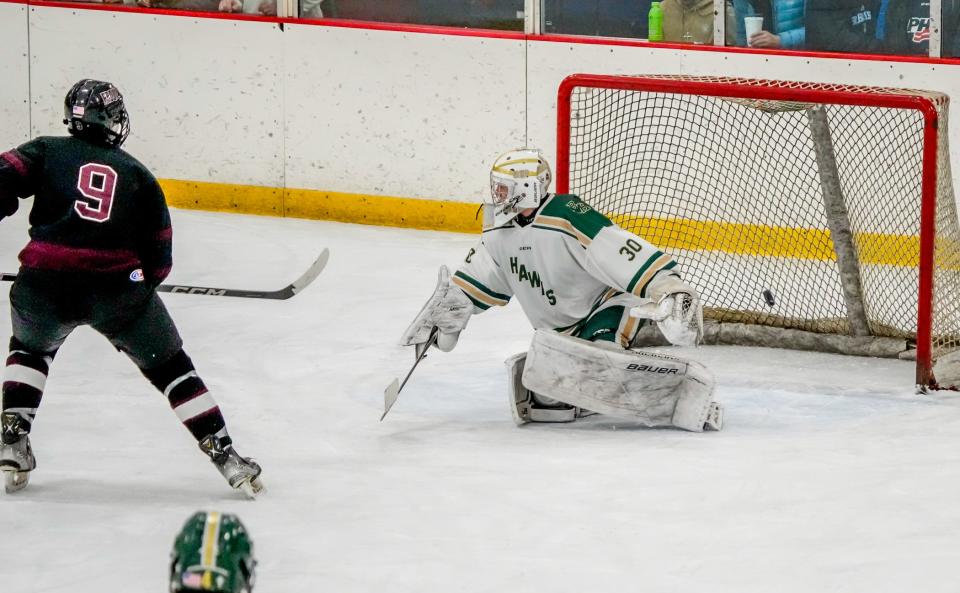 Caleb Burnett puts Prout ahead with second-period goal during Friday's game against Hendricken.