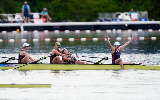 Team GB rowers celebrating on their boat