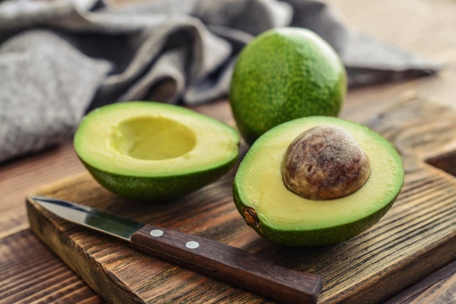 Man Cutting Avocado On A Wooden Cutting Board Personal Perspective Directly  Above View High-Res Stock Photo - Getty Images