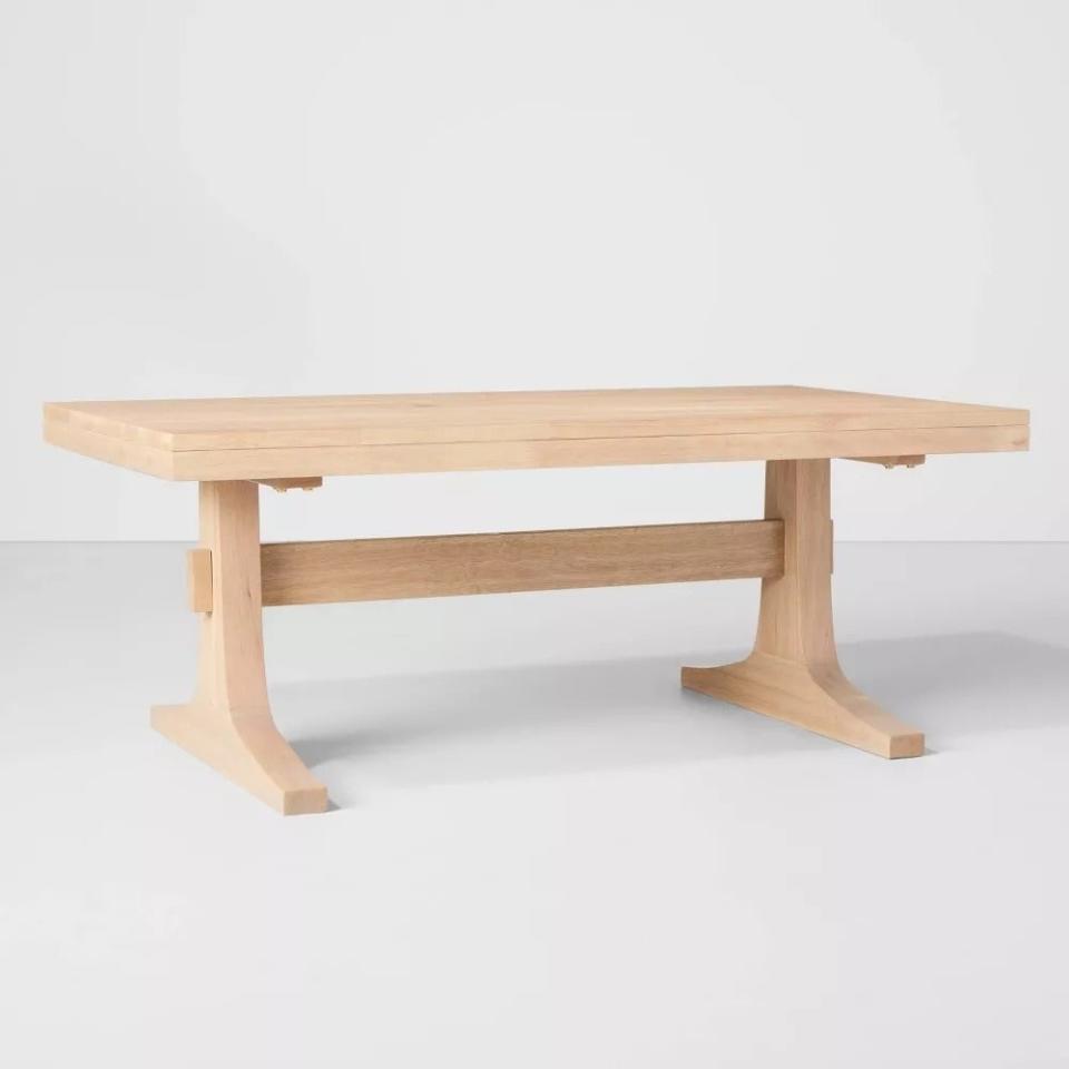 the light wood coffee table on a white space