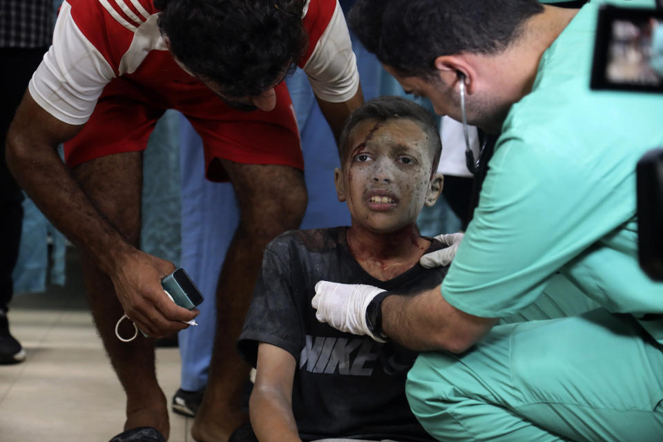 Palestinian medics treat a wounded child in an Israeli bombardment on a residential building owned by the Nasr family in Maghazi refugee camp, at al-Aqsa Martyrs Hospital in Deir al Balah, central Gaza Strip, Monday, June 24, 2024. (AP Photo/Saher Alghorra)