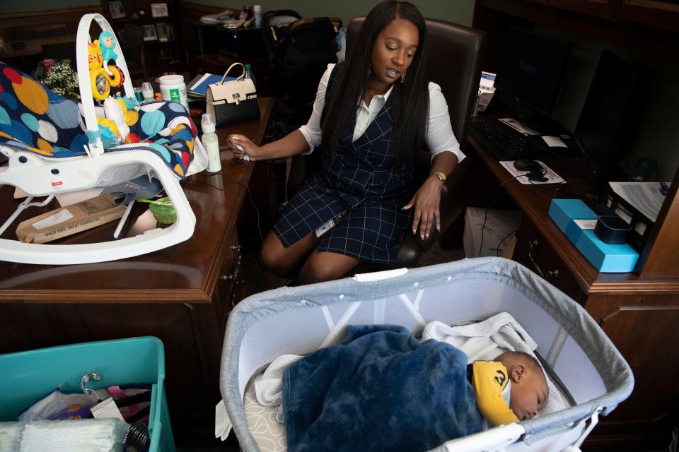 Sen. London Lamar D- Memphis, looks over to her 7-month-old son Nylinn, while working in her office at Cordell Hull State Office Building in Nashville, Tenn., Wednesday, Feb. 14, 2024.