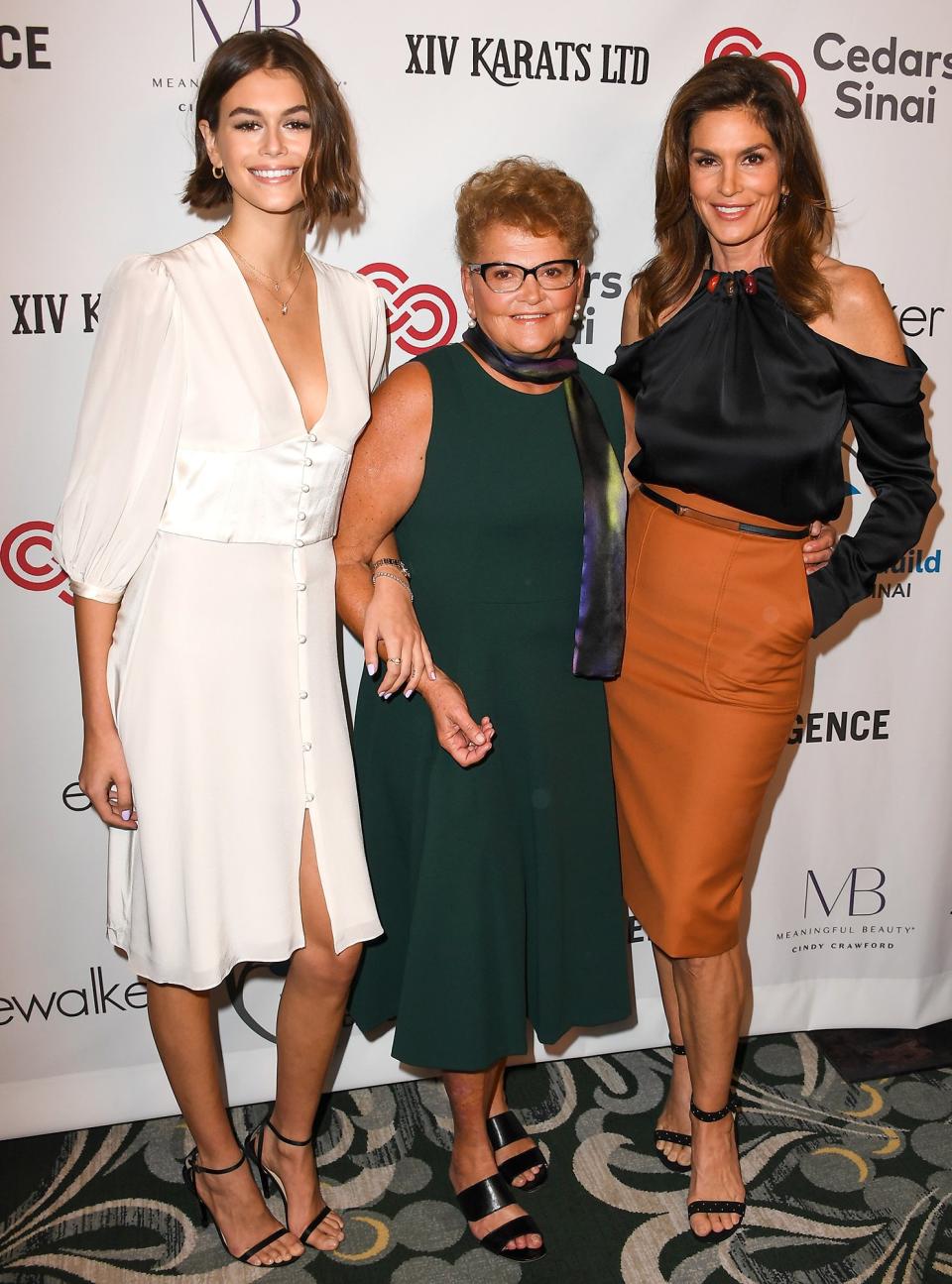 Kaia Gerber hangs with mom Cindy Crawford and grandmother Jennifer Sue Crawford-Moluf on Wednesday at the Women's Guild Cedars-Sinai Annual Luncheon at Regent Beverly Wilshire Hotel in Beverly Hills.