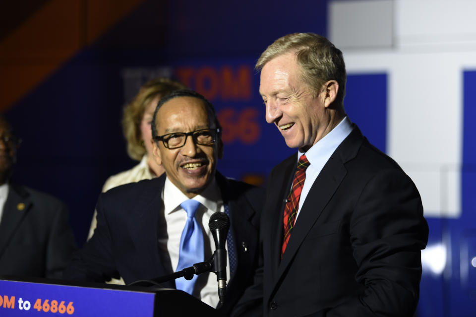 Democratic presidential hopeful Tom Steyer, right, receives the endorsement of South Carolina Democratic Black Caucus Chairman Johnnie Cordero, left, Saturday, Jan. 18, 2020, in Florence, S.C. (AP Photo/Meg Kinnard)