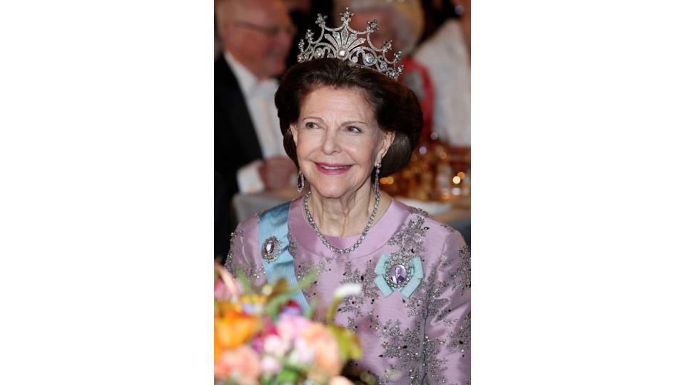 Queen Silvia in a pink dress and tiara