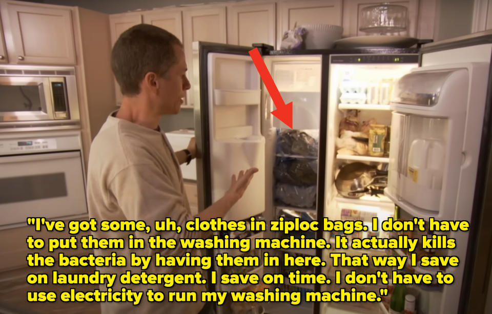 Man opening a refrigerator full of various food items in a kitchen scene from a TV show
