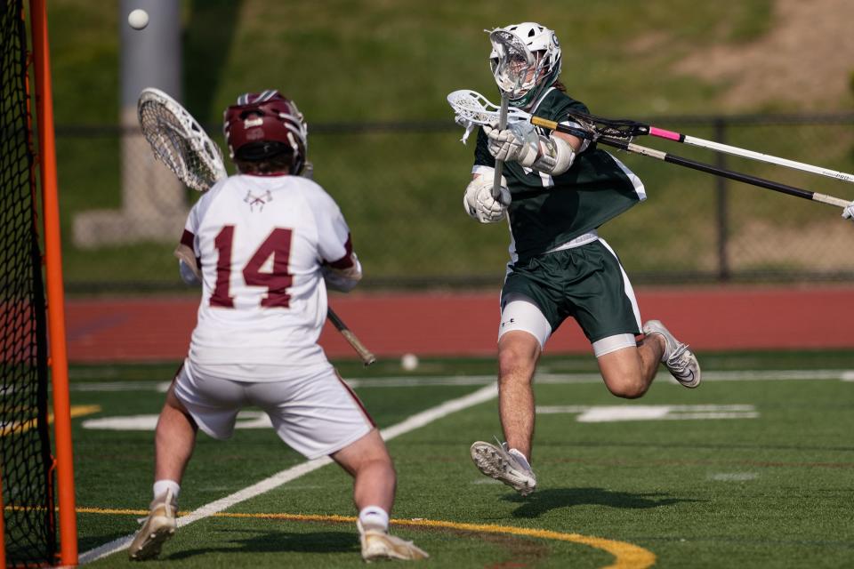 Algonquin keeper Nate Gulachenski is ready, but Grafton's Cam Michaud shoots just wide during the CMADA Class A final on Tuesday May 30, 2023 in Shrewsbury.