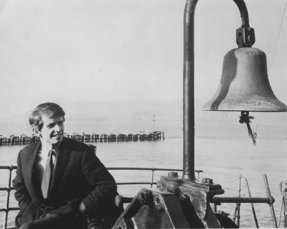 PHOTO: Ronan O’Rahilly with bell.  The late founder of Radio Caroline with the station's signature bell. (Offshore Echos Magazine)