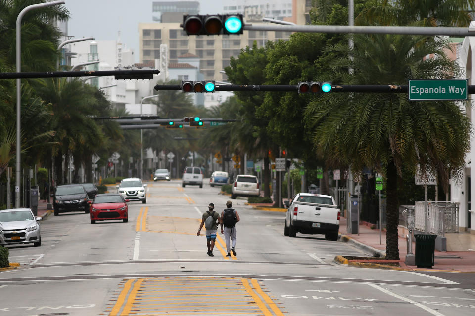 Local residents walks along an empty street in South Beach prior to the arrival of Hurricane Irma to south Florida, in Miami, Florida U.S., September 9, 2017. REUTERS/Carlos Barria