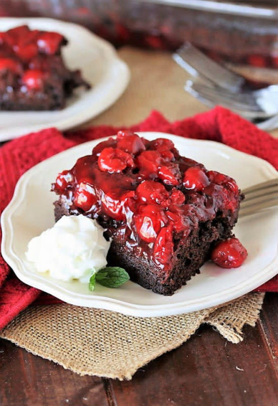 <p>The rich, fudgy cake base of this cake melds beautifully with the jammy sweetness of the cherry pie filling that crowns every bite. </p><p><strong>Get the recipe:</strong> <a href="https://www.thekitchenismyplayground.com/2019/03/moms-chocolate-cherry-upside-down-cake.html" rel="nofollow noopener" target="_blank" data-ylk="slk:Chocolate Cherry Upside Down Cake;elm:context_link;itc:0;sec:content-canvas" class="link "><strong>Chocolate Cherry Upside Down Cake</strong></a></p>