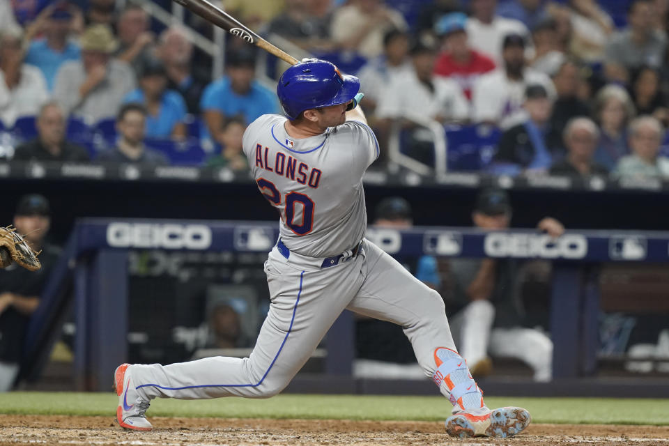 New York Mets' Pete Alonso (20) hits a two-run home run in the sixth inning of a baseball game against the Miami Marlins, Friday, Sept. 9, 2022, in Miami. (AP Photo/Marta Lavandier)