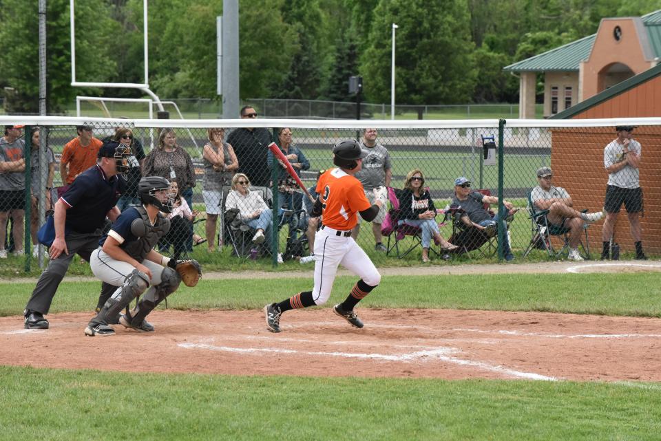 Tecumseh's Jacob Burns watches the ball as he hits a walk-off RBI single Friday in a Division 2 MHSAA district game at home against Chelsea.
