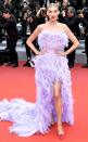 Elsa accessorizes her purple feathery gown with Nigora Tabayer jewelry at the <em>Sibyl</em> premiere. 