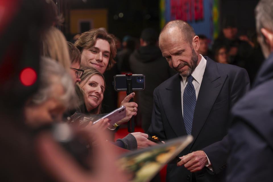 <p>Ralph Fiennes signs for fans at the Conclave premiere in London. (WireImage)</p>
