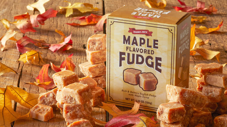A box of Maple Flavored Fudge, with pieces of fudge and autumn leaves