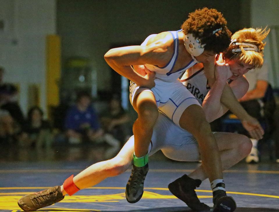 Braden River High's Matthew Ireland battles Tampa Jesuit's Malachi Ortiz in the final of the 120-pound weight class at the Class 2A-Region 3 Tournament on Saturday at Charlotte High. Ortiz pinned Ireland in the second period.