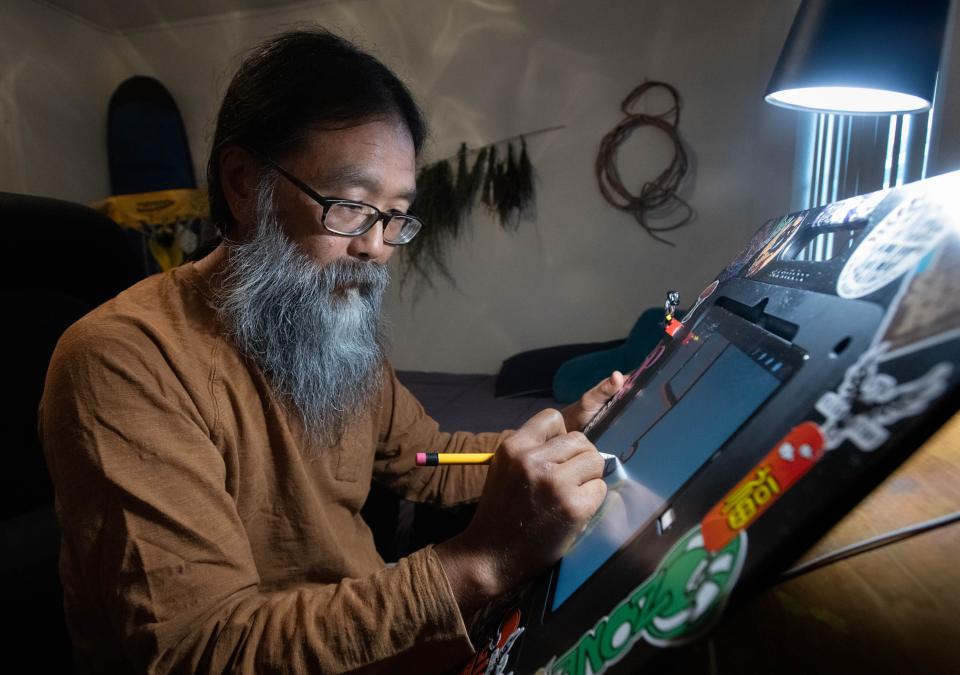 Martin Lee works on his comic strip called “The Other Ones” at his home in Pensacola on Tuesday, Nov. 14, 2023. Lee creates the comic strip along with his brother, Rich, who lives in Minnesota.