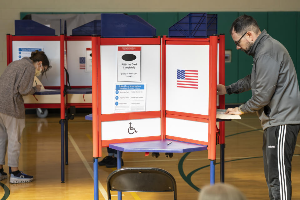 Voters cast their ballots at a polling location inside the Walter Reed Recreation Center on Nov. 8 in Arlington, Va. 