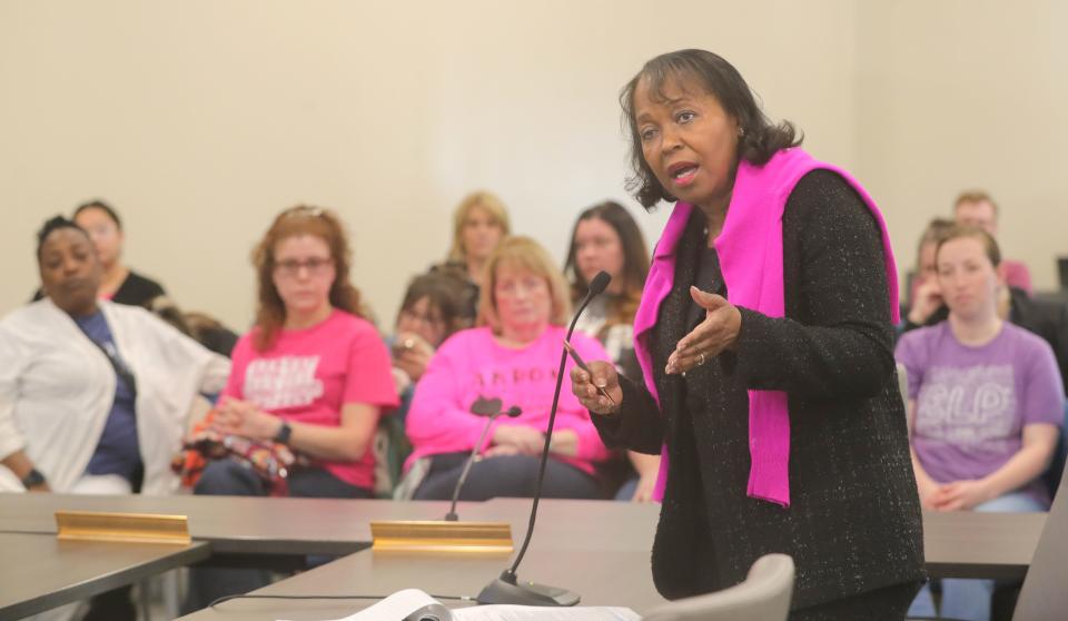Akron School Board member Barbara Sykes addresses board members during Akron's special meeting.