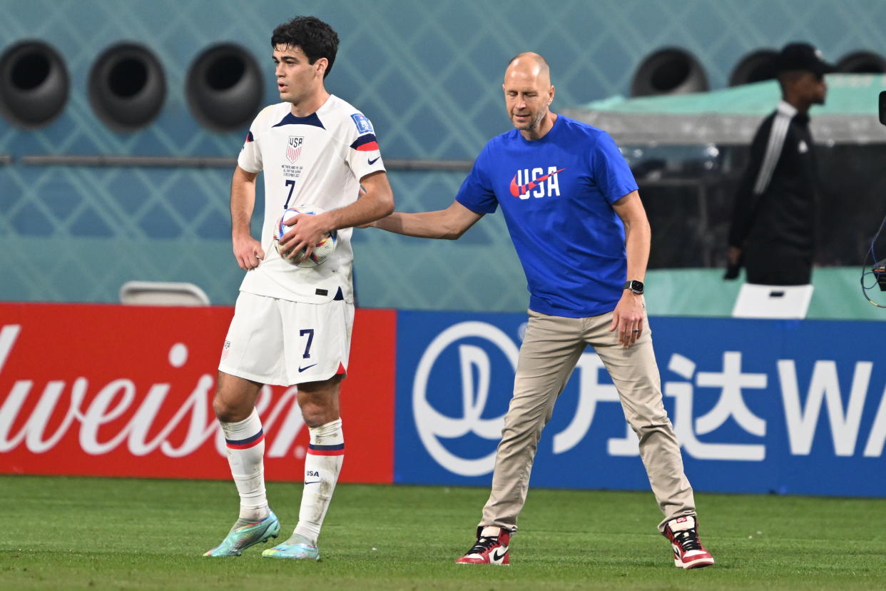 DOHA, QATAR - DECEMBER 03: Giovanni Reyna (7) and head coach Gregg Berhalter (R) of USA during the FIFA World Cup Qatar 2022 Round of 16 match between Netherlands and USA at Khalifa International Stadium on December 03, 2022 in Doha, Qatar. (Photo by Ercin Erturk/Anadolu Agency via Getty Images)