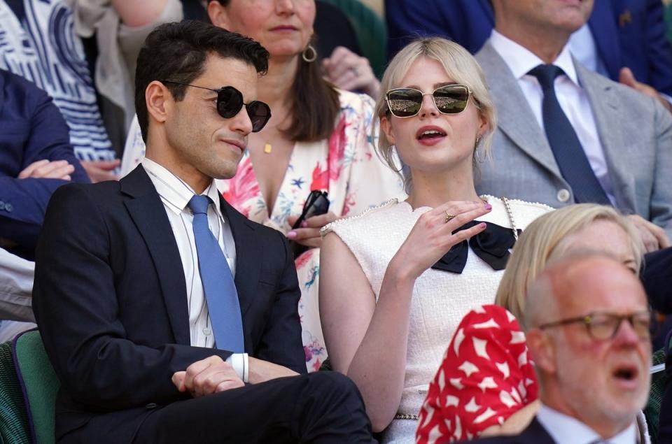 Rami Malek and Lucy Boynton in the Royal Box at Wimbledon on 8 July 2022 (PA)