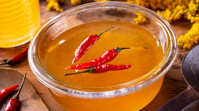 Bowl of hot honey with dried peppers
