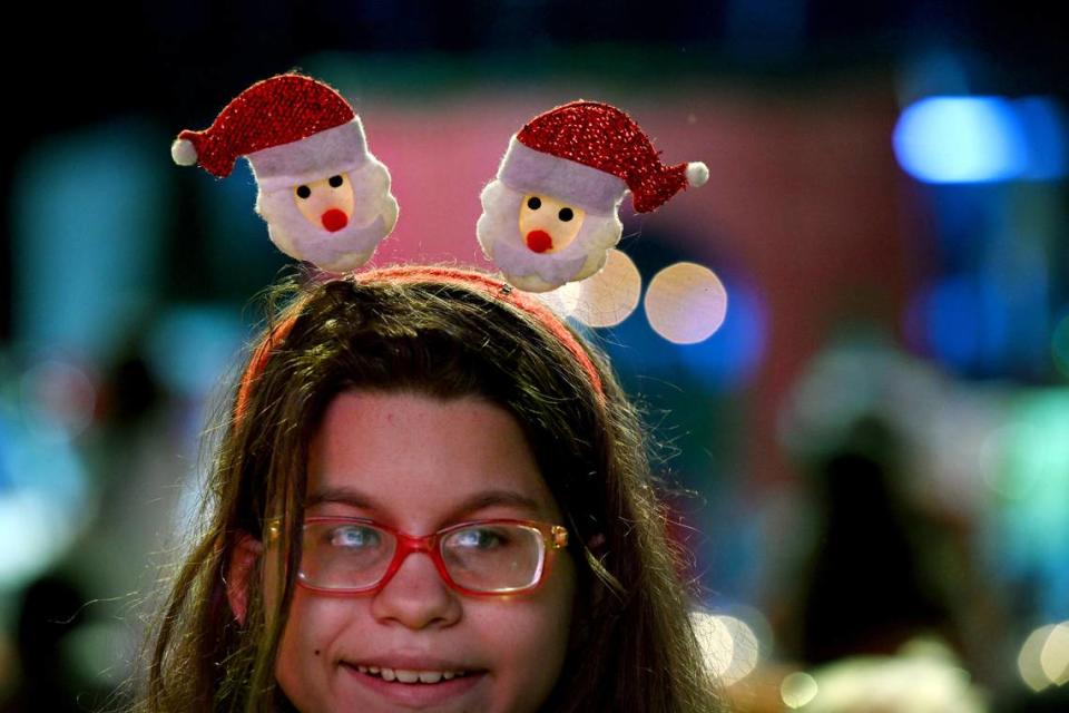 Children and adults wore holiday festive wear at the 38th annual Flight to the North Pole program for children with disabilities and terminal illnesses at Feld Entertainment in Palmetto.