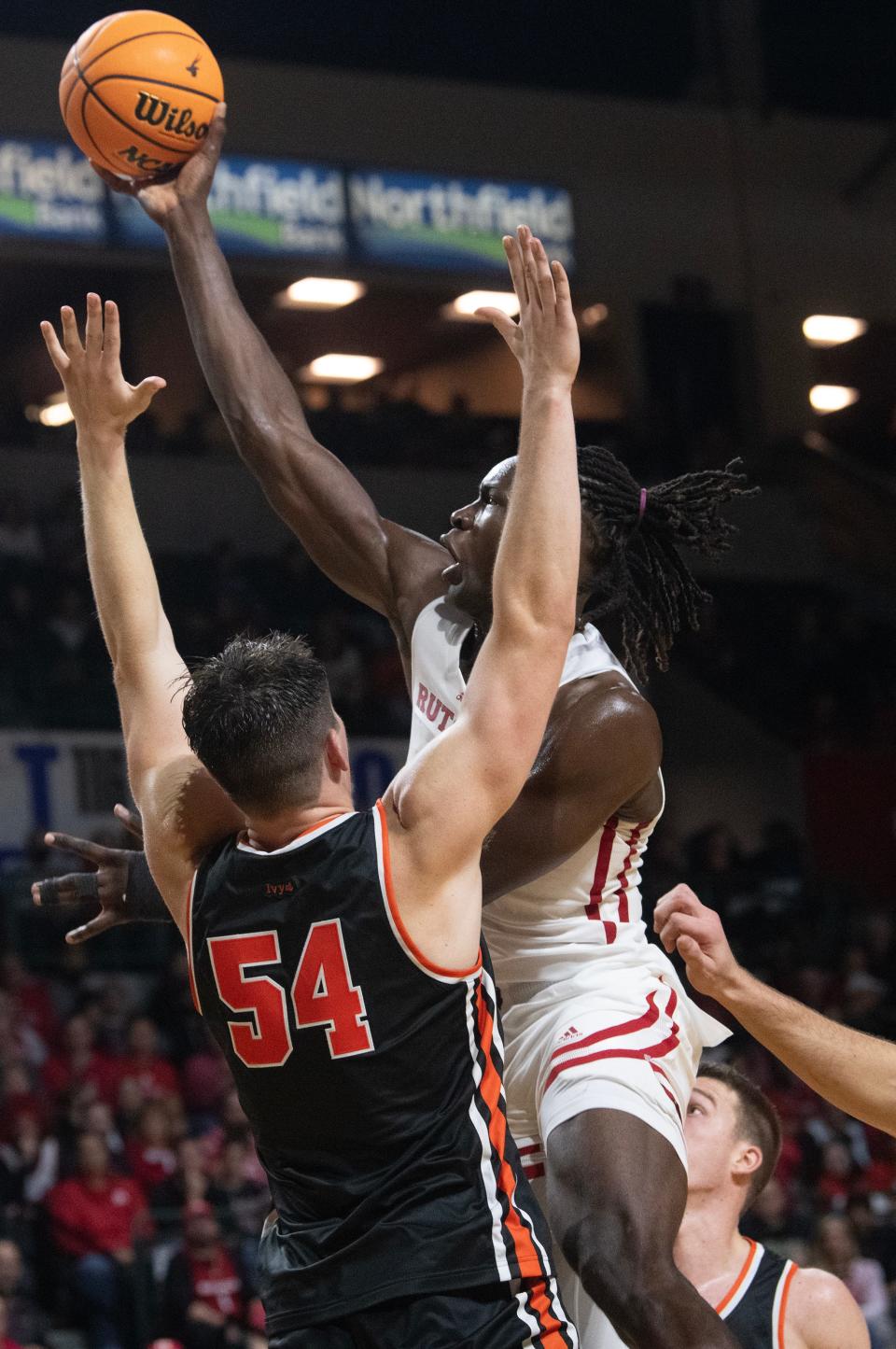 Rutgers' Clifford Omoruyi shoots above Princeton's Zach Martini during the men's college basketball game played at the Cure Insurance Arena in Trenton on Monday, November 6, 2023.