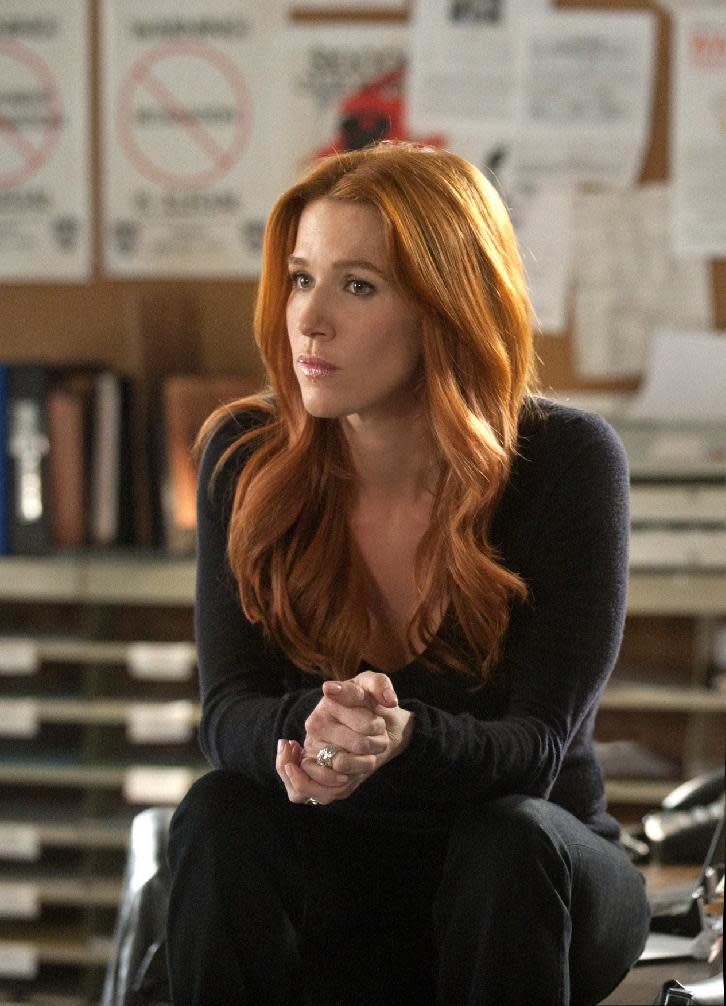 In this publicity image released by CBS, Poppy Montgomery is shown in a scene from "Unforgettable." (AP Photo/CBS, Barbara Nitke) "