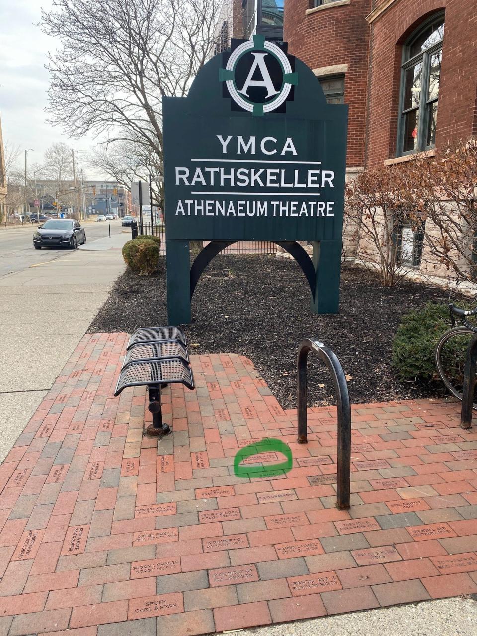 The rain garden at the landmark Athenaeum building at 401 E. Michigan St. includes bricks purchased as a fundraiser and laid in June 2013. The circle marks a brick from Charles and Dianna Kennedy declaring, "Cheese is for babies."