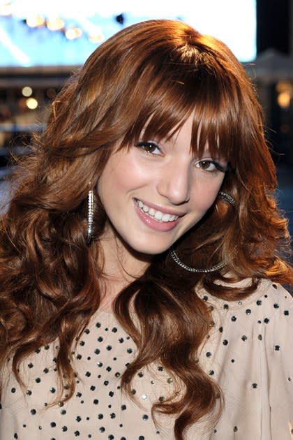 <p><strong>January 2012</strong></p> <p>Bella veers toward va-va-va volume at the 2011 People's Choice Awards. Her statement earrings take center stage against a backdrop of ample locks, a wispier blunt bang, smoked-out liner, and natural gloss.</p>